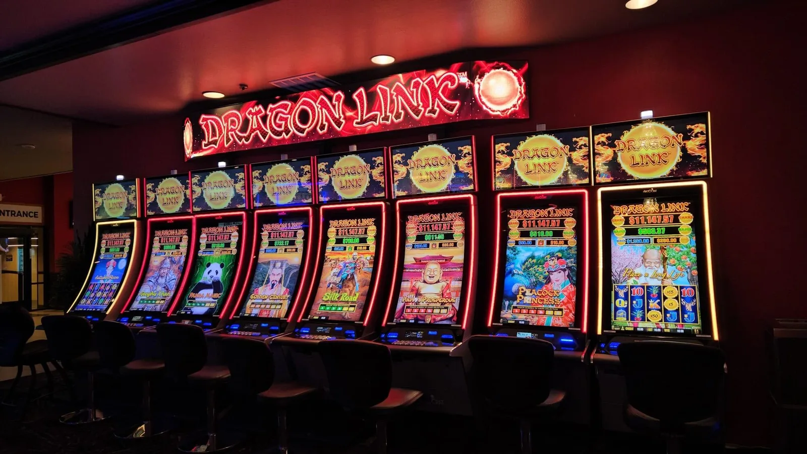 Row of Dragon Link pokie machines in a gaming venue